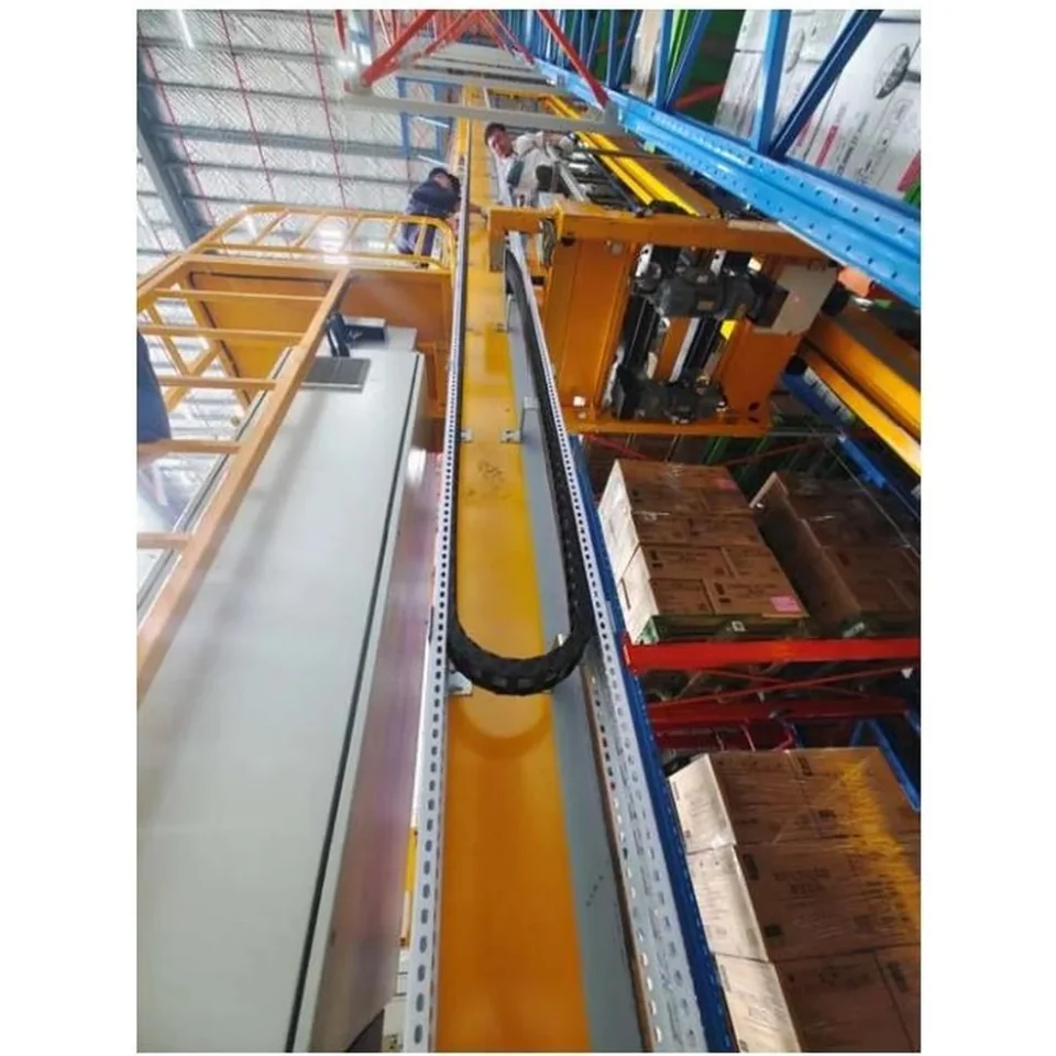On-site mounting of cable carrier on automated warehouse system